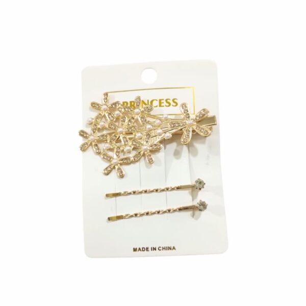 Set invisible y traba dorado con strass