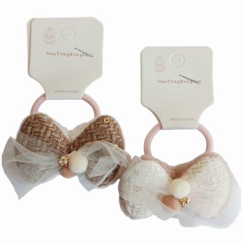 Colita con moño y apliques