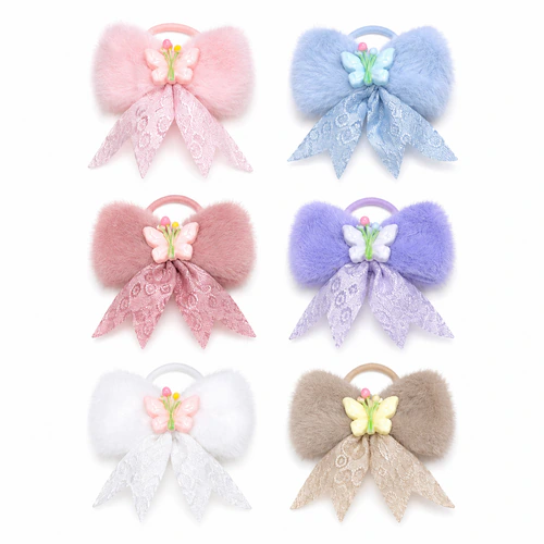 Blister colitas moño peluche con aplique x6